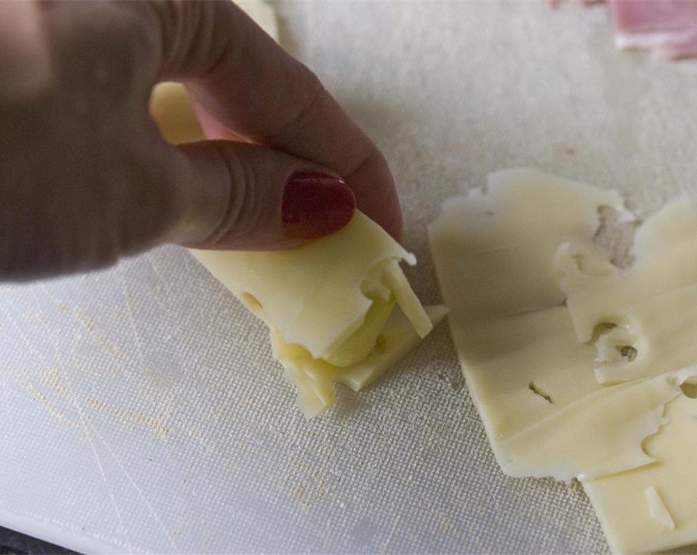 step 5 Wrap each potato in the emmental cheese.
