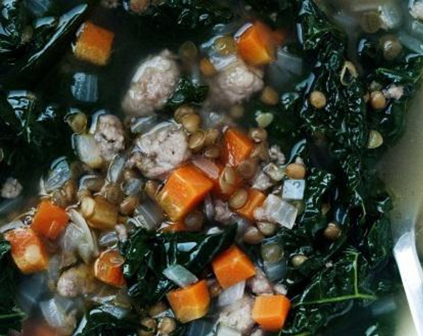 step 4 Add Tuscan Kale (2 cups) and Lentils (3/4 cup) to the soup, bring back to a simmer and cook for 5 more minutes.