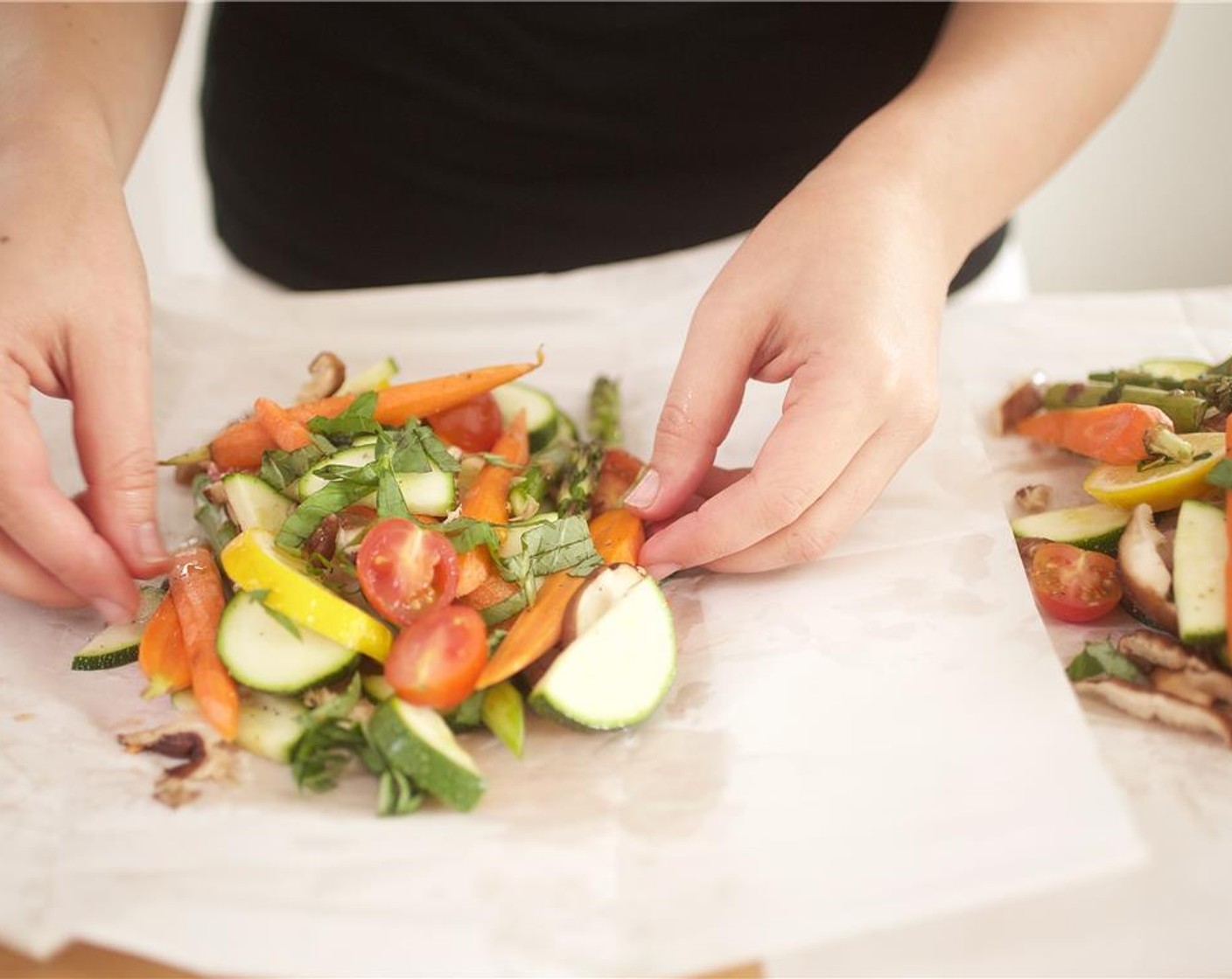 step 9 Add White Cooking Wine (1/4 cup) and 2 teaspoon of Olive Oil (1/2 Tbsp). Bring the edges of the parchment paper to the center and fold together tightly. Place packets on a sheet pan.