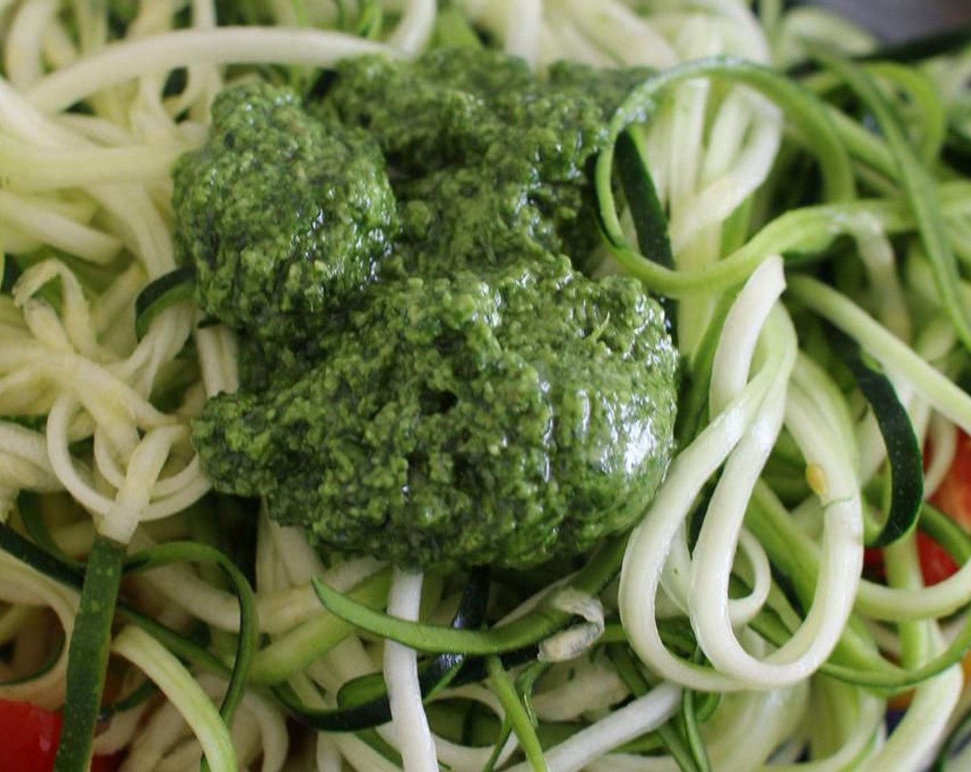 step 2 Place zucchini spaghetti in a large mixing bowl with Cherry Tomatoes (1 1/3 cups) and Basil Pesto (2 Tbsp). Mix gently until pesto is fully combined.