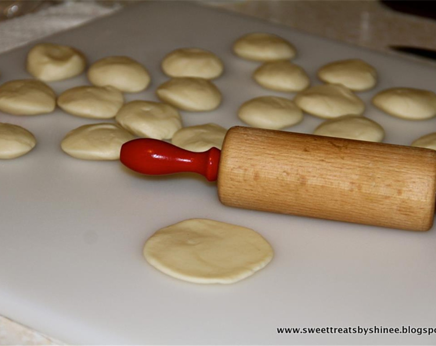 step 9 Cut the chilled dough into 24 pieces. Flatten each piece a little and place into a mini muffin pan. Pour 1/2 teaspoon of Marinara Sauce (1/2 cup) into each muffin cup. Add sausage mixture.