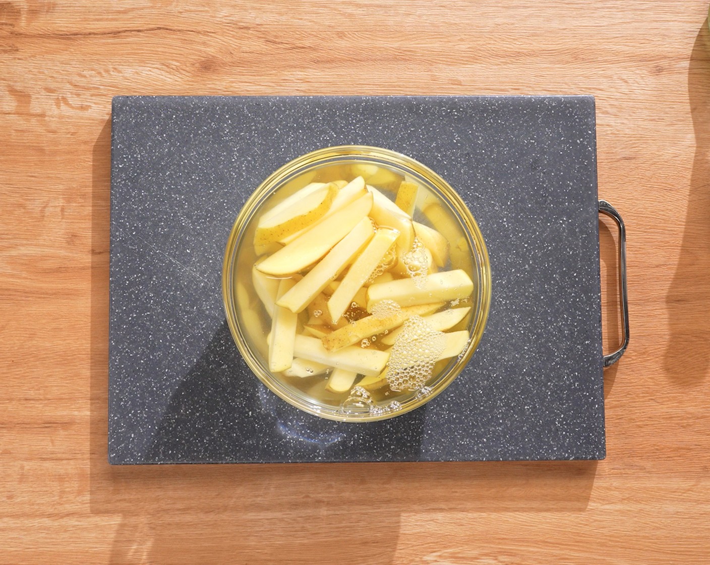 step 1 Cut the Russet Potatoes (2 lb) into ½-inch lengthwise pieces, and make sure they are even. Soak in cold water for at least 30 minutes.