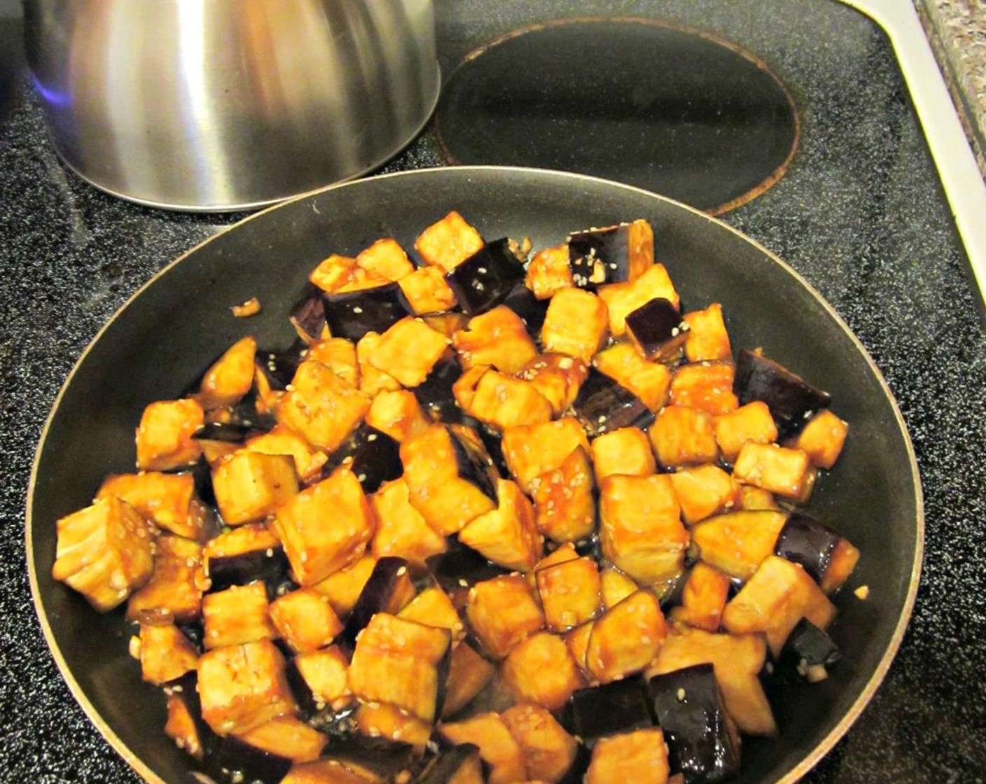 step 7 While fish is cooking, sauté eggplant in a large sauté pan over medium-low heat with several tablespoons of your marinade. The eggplant will need to cook for about 10 minutes, but you don't want to overcook it.