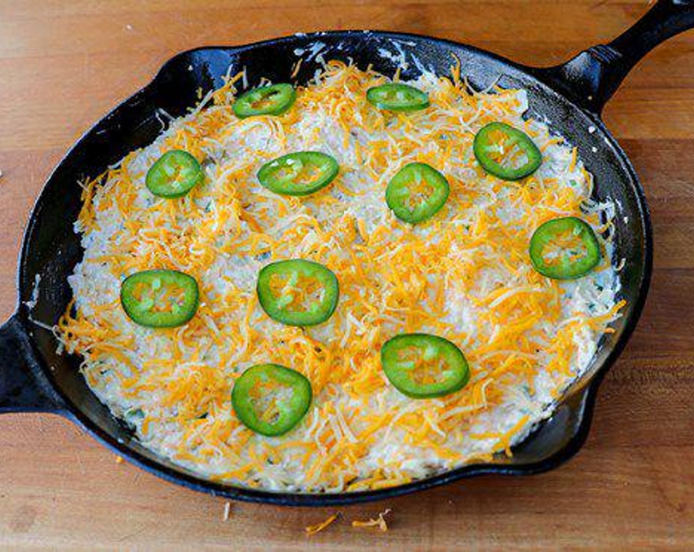 step 6 Top with Shredded Mexican Cheese Blend (1/4 cup) and Jalapeño Pepper Slices (to taste).