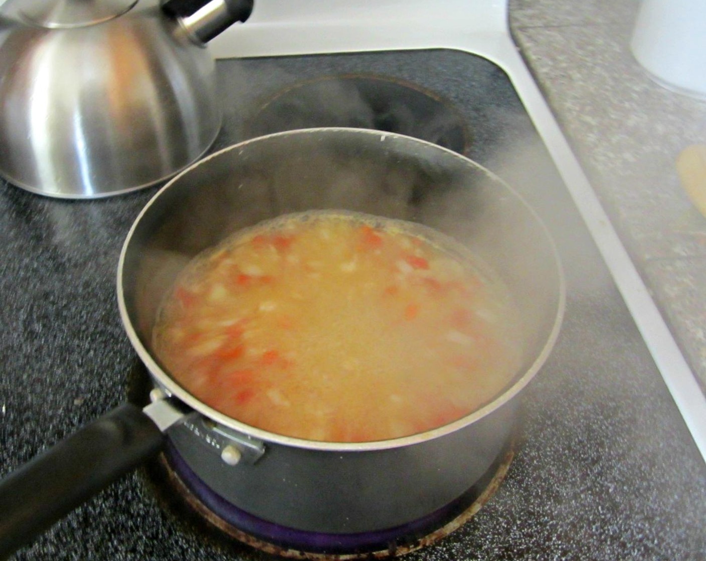 step 10 In a large saucepot, saute the remaining  onion and garlic cloves. After a minute or two (these veggies don't need to be cooked through), add the Salsa Verde (2/3 cup), Water (1/4 cup), Low-Sodium Chicken Stock (1 cup), and to Ro-Tel® Diced Tomatoes & Green Chilies (1 can).