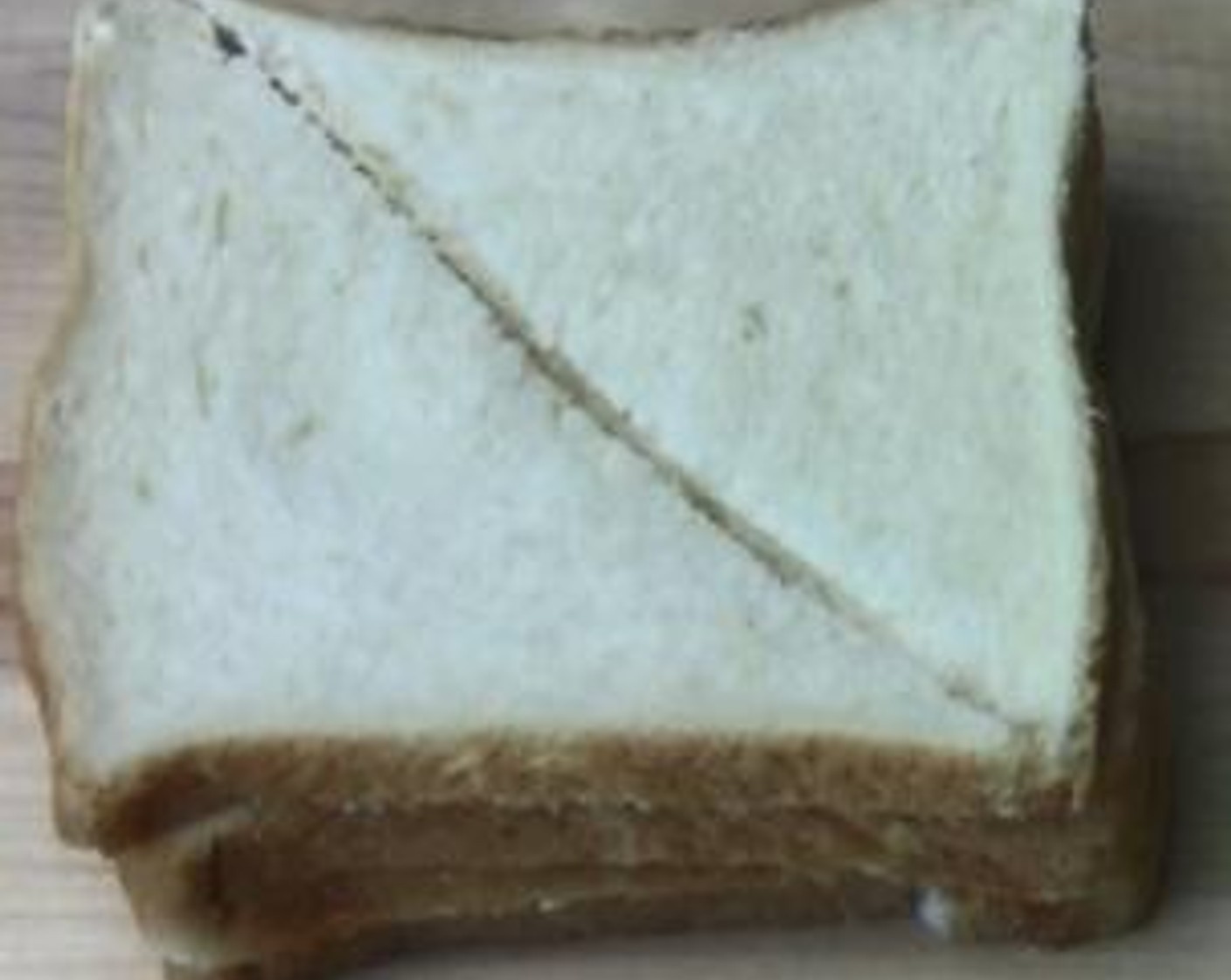 step 2 Cut the White Bread (4 slices) diagonally.