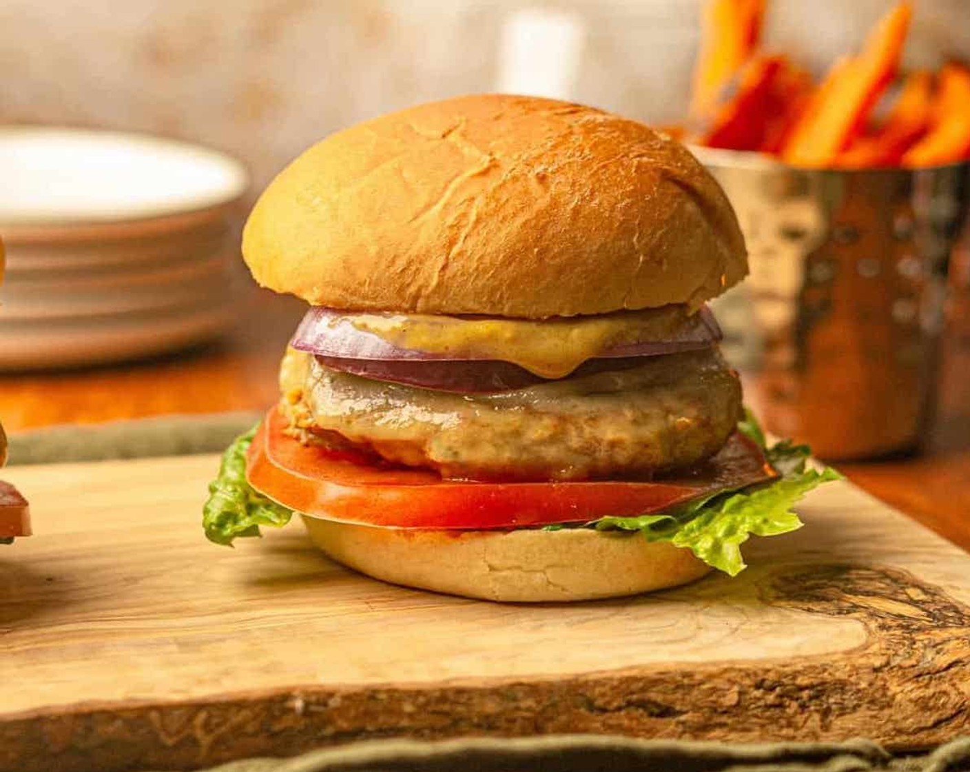 step 7 Serve the burgers warm on a toasted Hamburger Buns (4) with Lettuce (to taste), Tomatoes (4 slices), sliced red onion, or your favorite toppings.