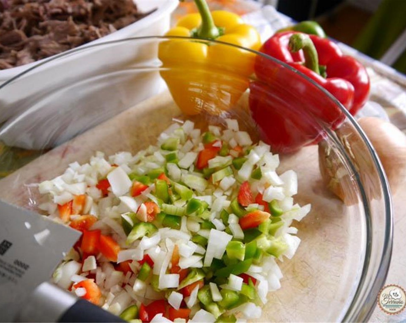 step 5 Chop the Onion (1), Green Bell Pepper (1), Red Bell Pepper (1). and Garlic (4). In a hot pan, add the Vegetable Oil (3 Tbsp) and add the chopped vegetables and garlic. Leave to sweat for 5 minutes.