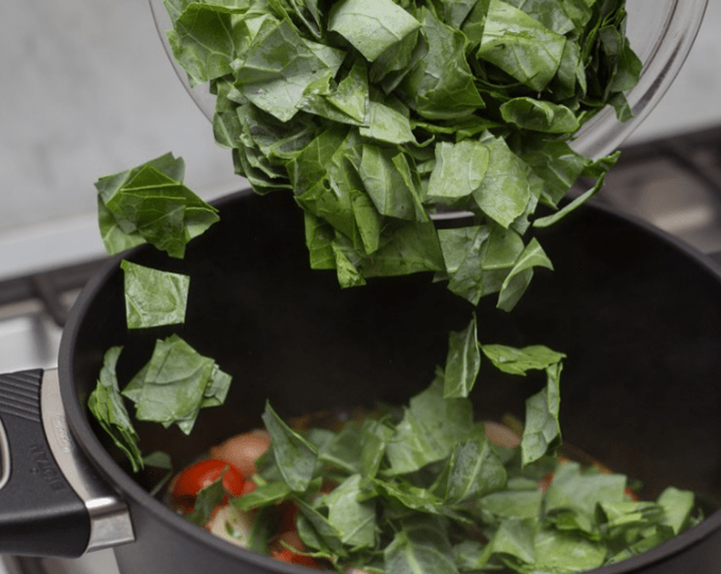 step 9 When beans are dark green and soft, add collard green stems and leaves. Remove cover from pot, and cook until collards are tender and only about 1/4-inch of liquid remains in pot, 5-6 minutes. Turn off heat, stir well, and adjust seasoning to taste with Salt (to taste).