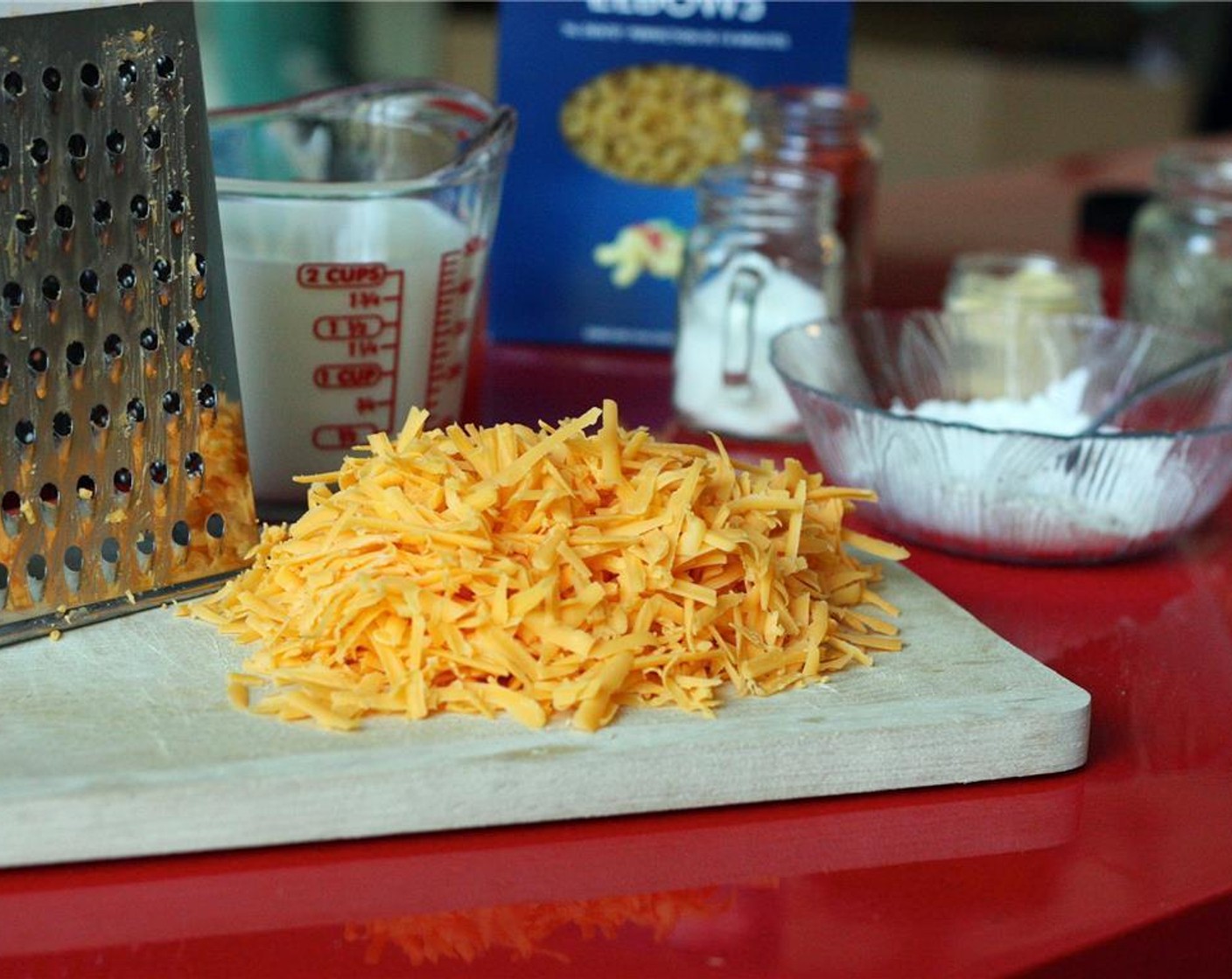 step 2 Measure out Milk (2 cups) and grate the Cheddar Cheese (2 cups). Set aside.