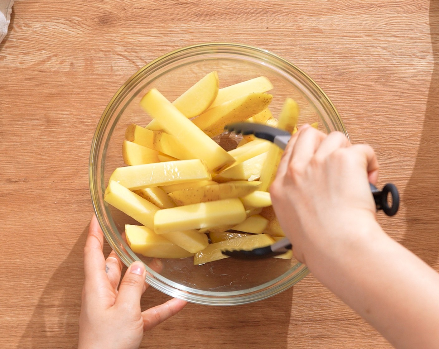 step 4 Drain and pat dry the potatoes with paper towels. Place in a mixing bowl, and toss evenly with Cooking Oil (1 Tbsp).