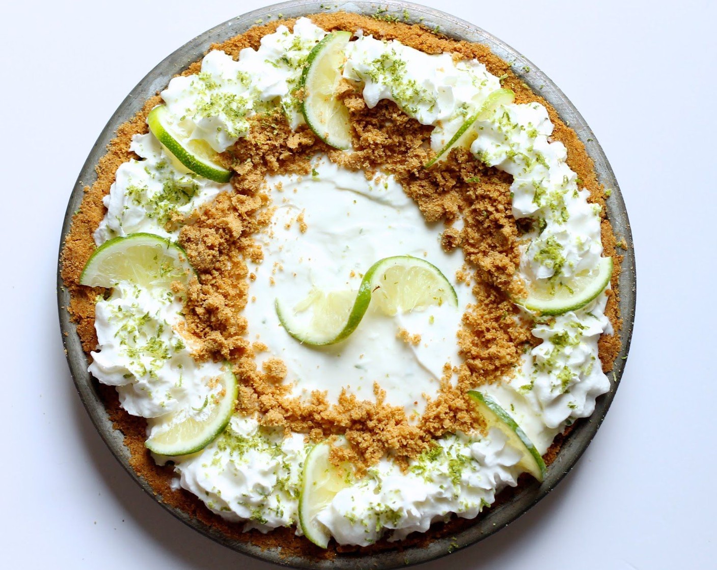 step 12 Garnish with Whipped Cream (to taste), Limes (to taste) and the reserved graham cracker crumbs.