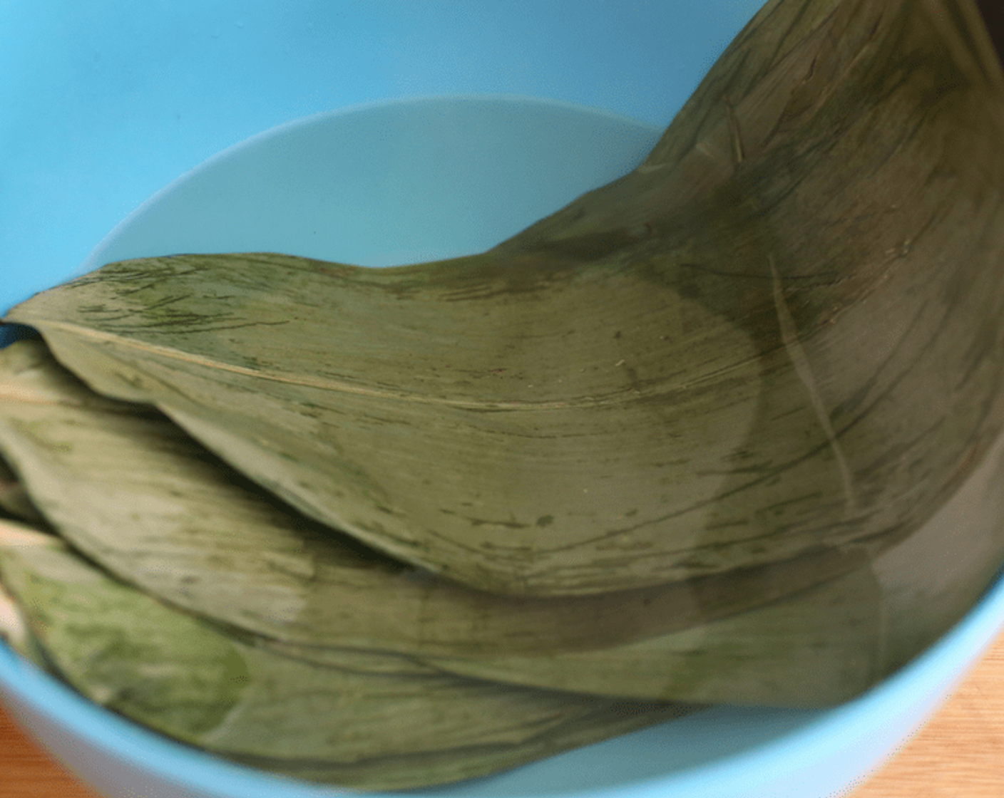 step 7 Boil palm leaves in boiling water until soft.