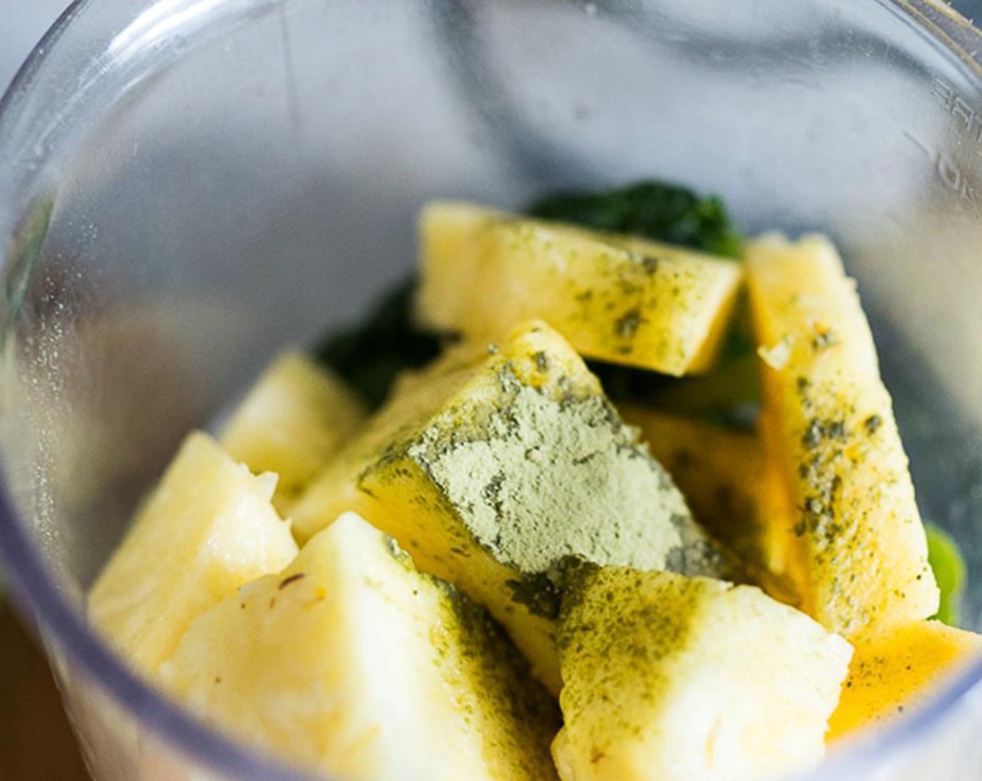 step 1 In a blender, add the Pineapple (1 cup), Banana (1), Kale (1 cup), Matcha Powder (1/2 tsp), Nut Milk (1/2 cup), a squeeze of fresh Lemons (to taste), and Ice (1 handful). Blend until very smooth.