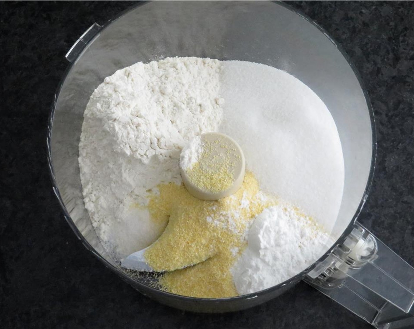 step 3 In a food processor, add All-Purpose Flour (3/4 cup), Cornmeal (1/2 cup), Granulated Sugar (1/3 cup), Baking Powder (1/2 Tbsp) and Salt (1/4 tsp). Pulse to combine. Cut Unsalted Butter (1/4 cup) into chunks and add to flour mixture.