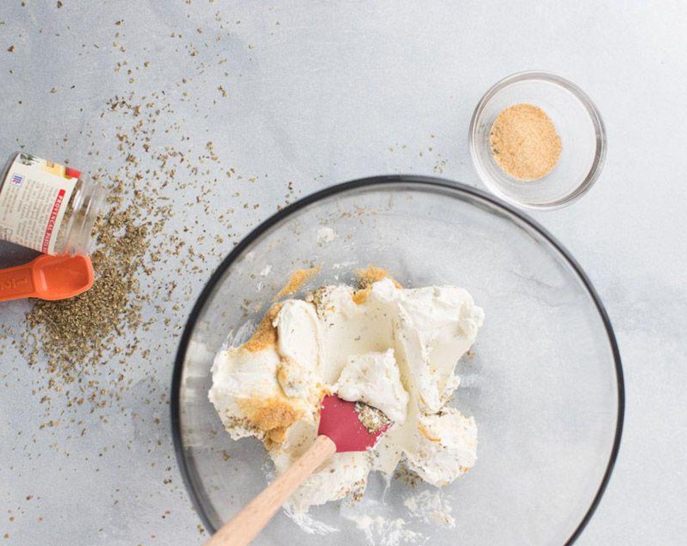 step 2 Mix Cream Cheese (1 cup), McCormick® Garlic Powder (1/2 tsp), and Dried Marjoram (1/2 tsp) in a medium-sized mixing bowl and mix until combined.