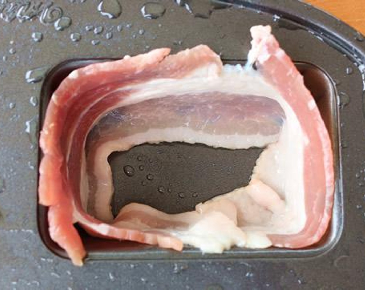 step 4 Spray a mini loaf pan with Vegetable Oil Cooking Spray (as needed) and line each cavity with a slice of Center Cut Bacon (8 slices).