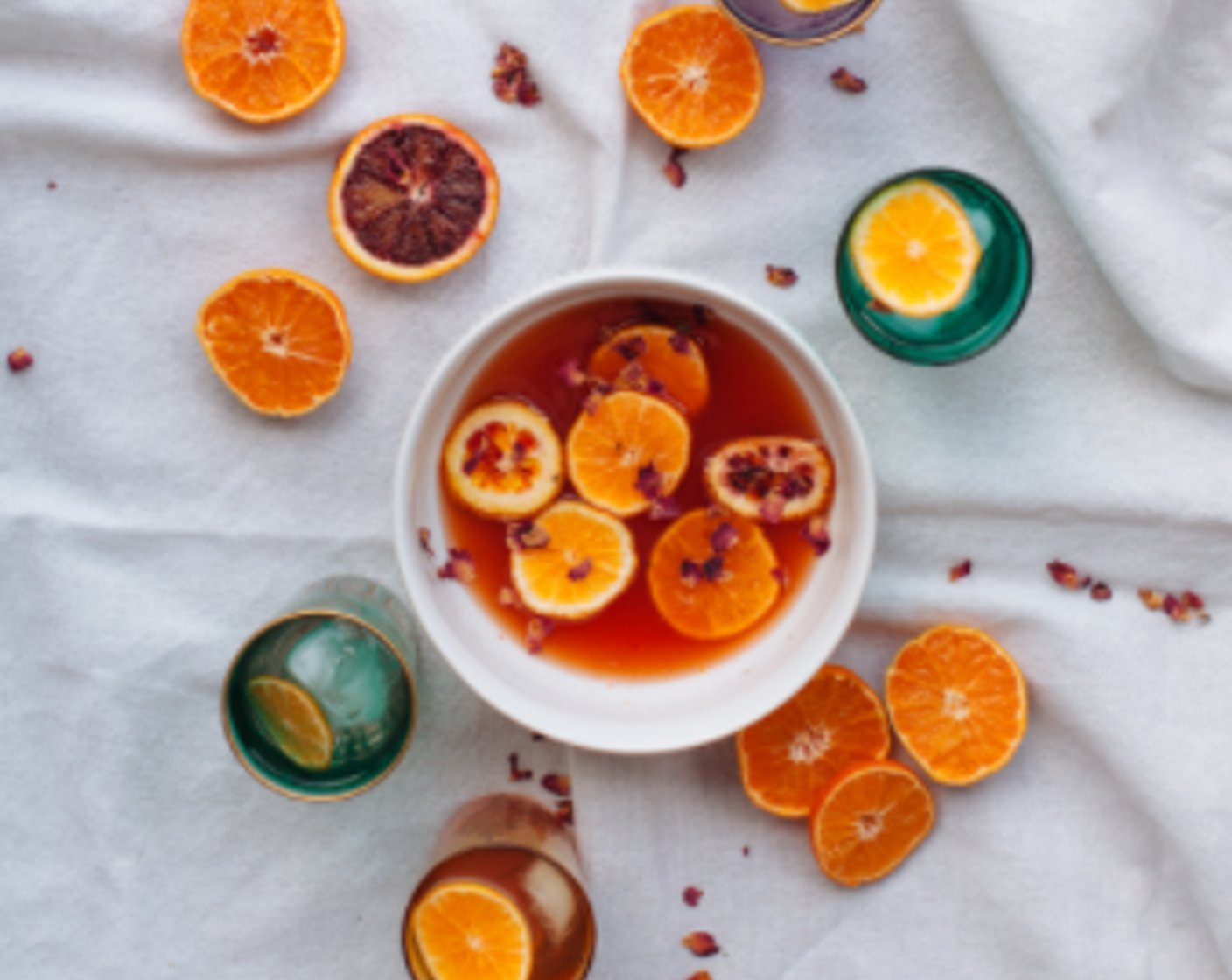 step 4 When ready to enjoy, pour 1 part Citrus Shrub Punch into glass with 1 part Club Soda (to taste). Garnish with Oranges (to taste), Madagascar Vanilla Bean (to taste), and Edible Dried Rose Petals (to taste).