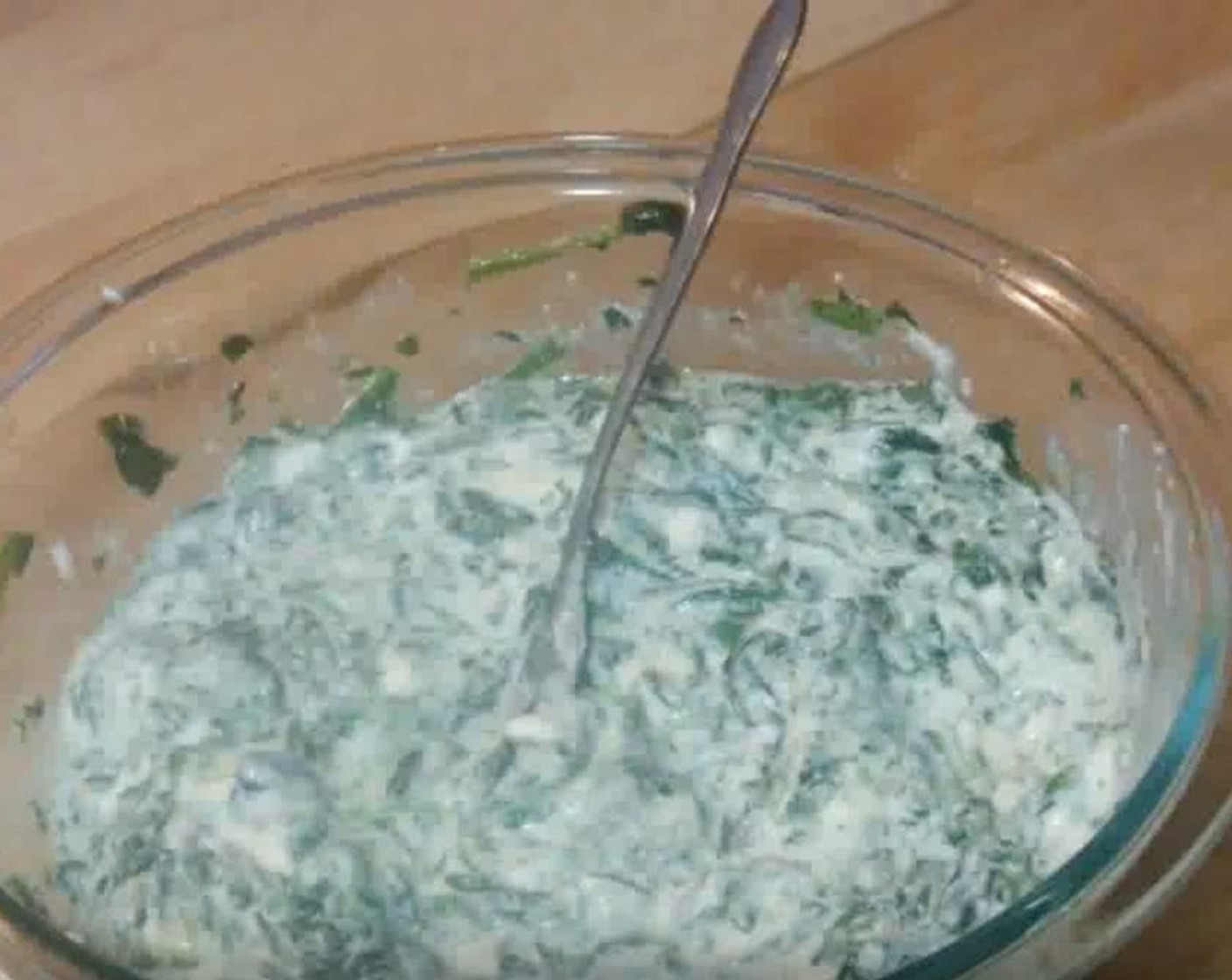 step 6 In a mixing bowl, add thawed Frozen Spinach (1 cup), beaten Eggs (2), and Ricotta Cheese (1 1/2 cups). Mix until well combined.