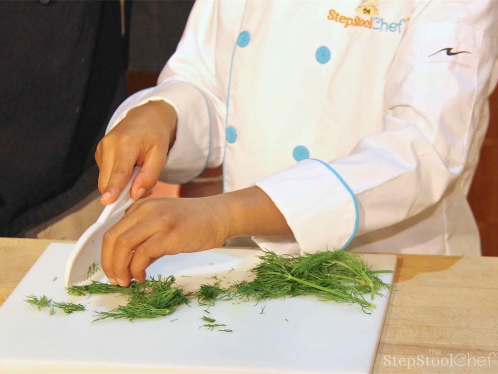 Step 2 of Italian Baked Tilapia Parmesan & Basil Pesto Rice Recipe: Begin by preparing the herbs. Roughly chop the fresh Fresh Parsley (1 handful) and Fresh Dill (1 handful) together and set aside. Chop the fresh Fresh Basil (1/2 bunch) separately and set aside.