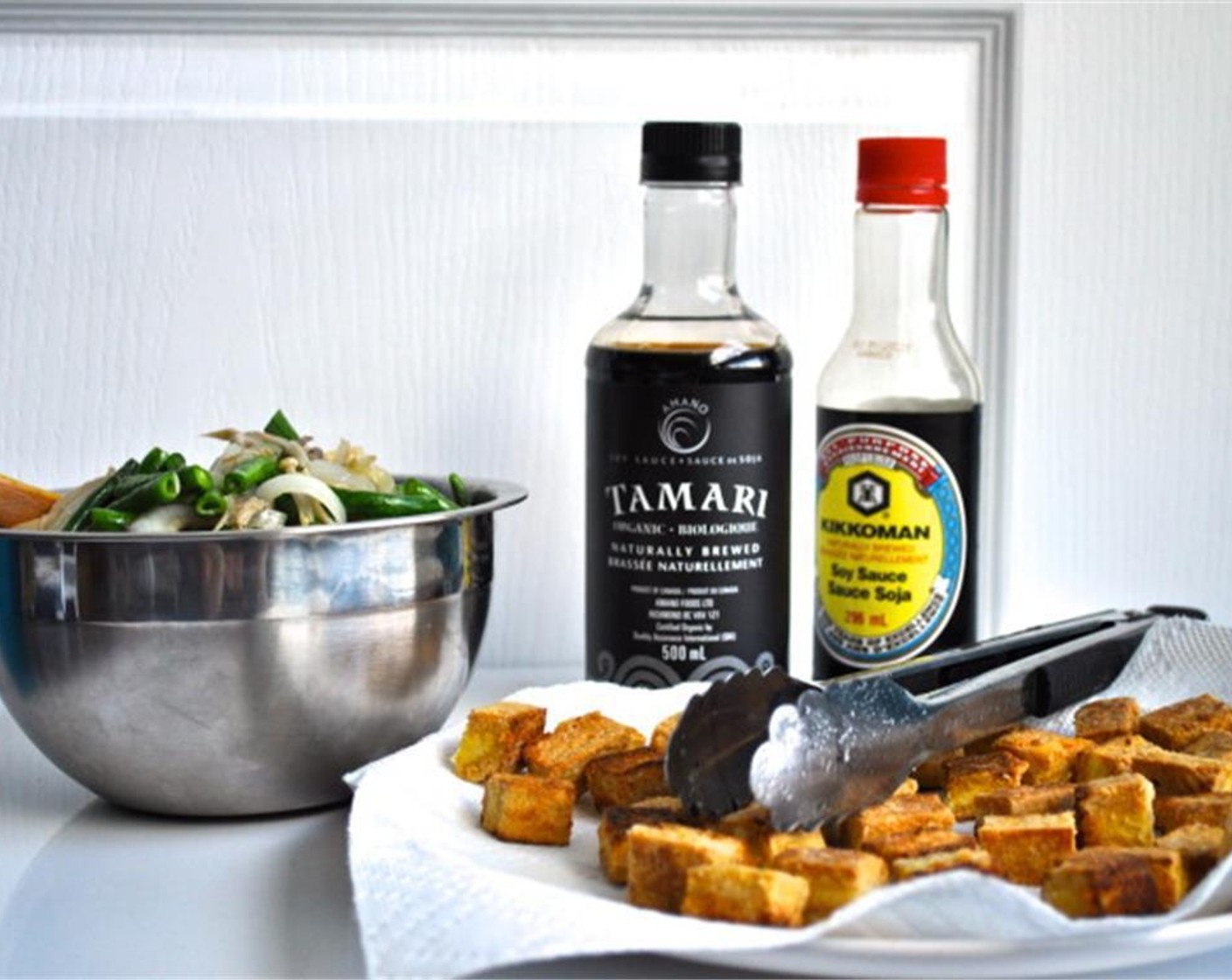 step 5 In a medium sized pan over medium-high heat, add your Canola Oil (1/4 cup) and fry tofu until all of the sides are golden brown.