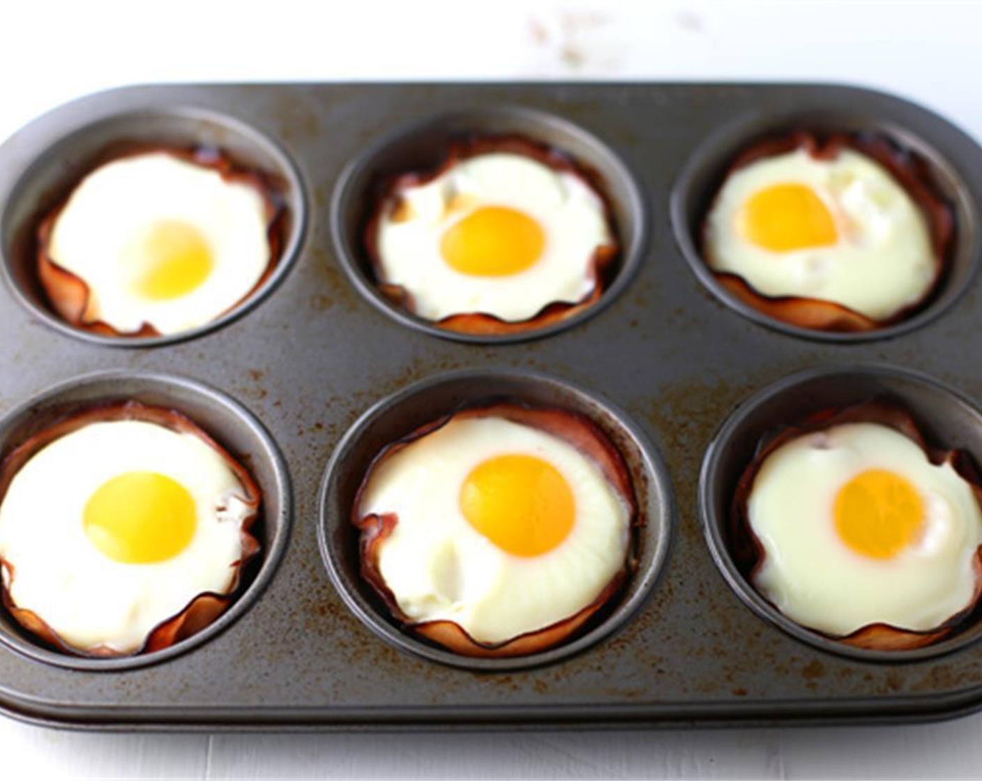 step 3 Bake for 10-15 minutes, or until the eggs are cooked according to your preference (soft, medium, or hard). 15 minutes will cook the yolk all the way through.