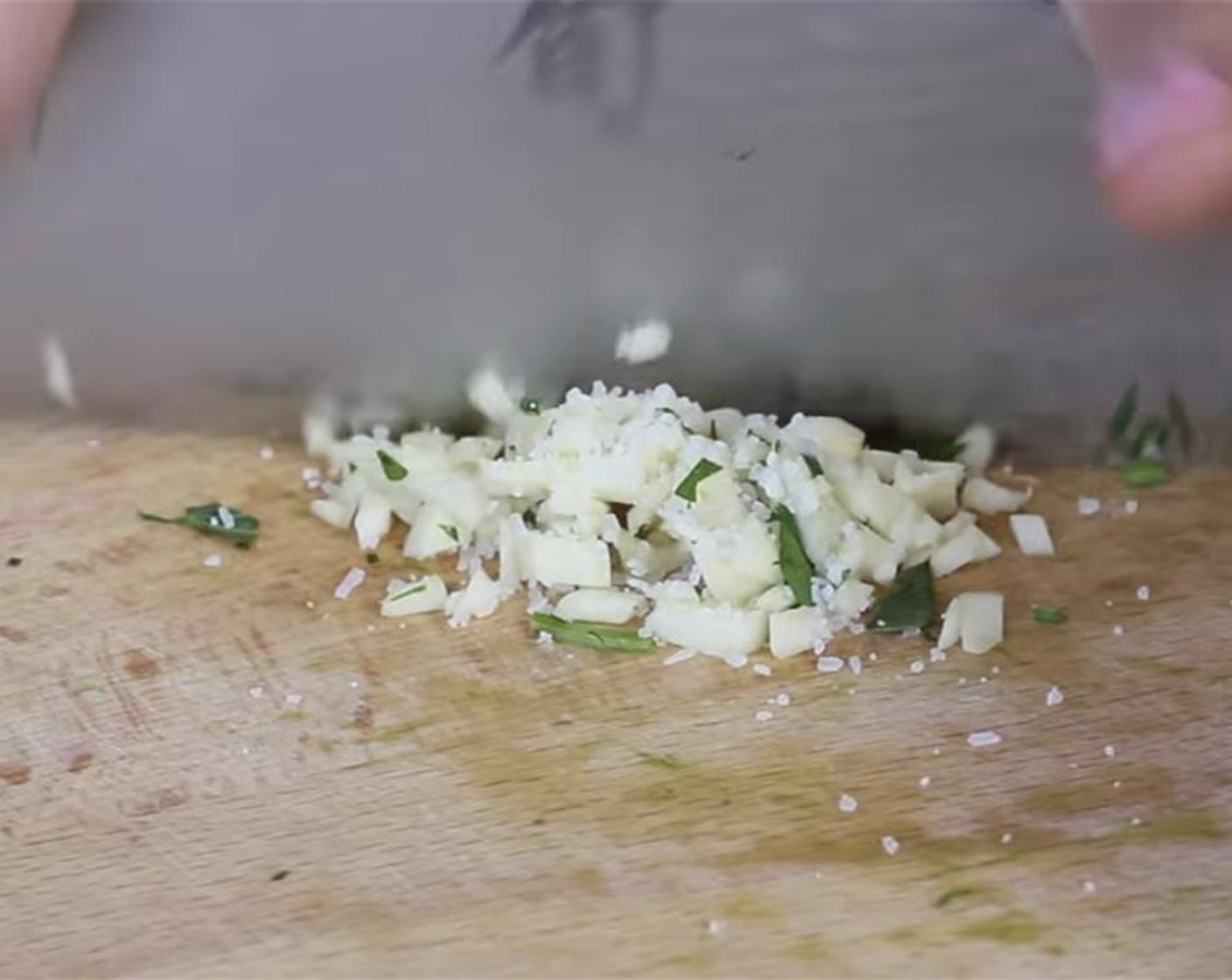 step 8 Finely mince the Garlic (1 clove) with some Salt (to taste) then add to the blender. The salt helps make a fine garlic paste. Use your knife to scrape down and chop to make the paste.