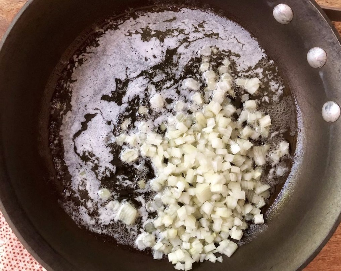 step 4 To make the white sauce, in a medium saucepan melt Unsalted Butter (4 Tbsp) and cook the Onion (1) over medium heat for about 5 minutes or until softened.