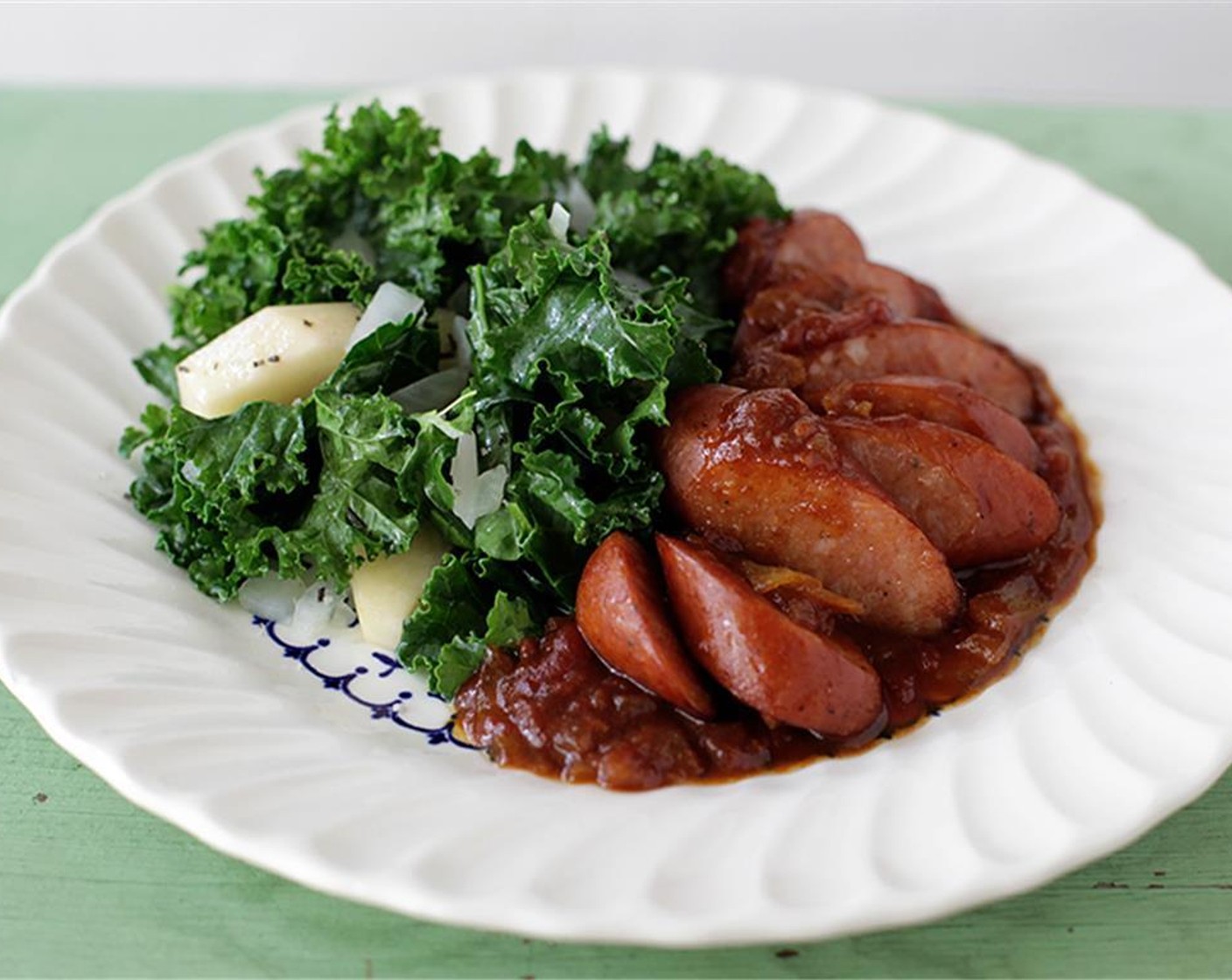 step 9 Cook at a simmer for about 20 min. Season to taste with kosher salt (to taste) and Black Pepper (to taste). Slice the sausage and return to the pan, and reheat in the sauce. Serve and enjoy!