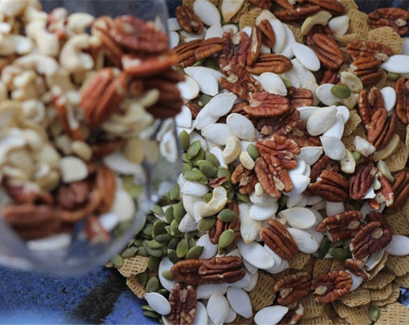 step 2 In a large bowl, add Multigrain Cereal (4 cups). Add in Mixed Nuts and Seeds (5 cups) of your choice.