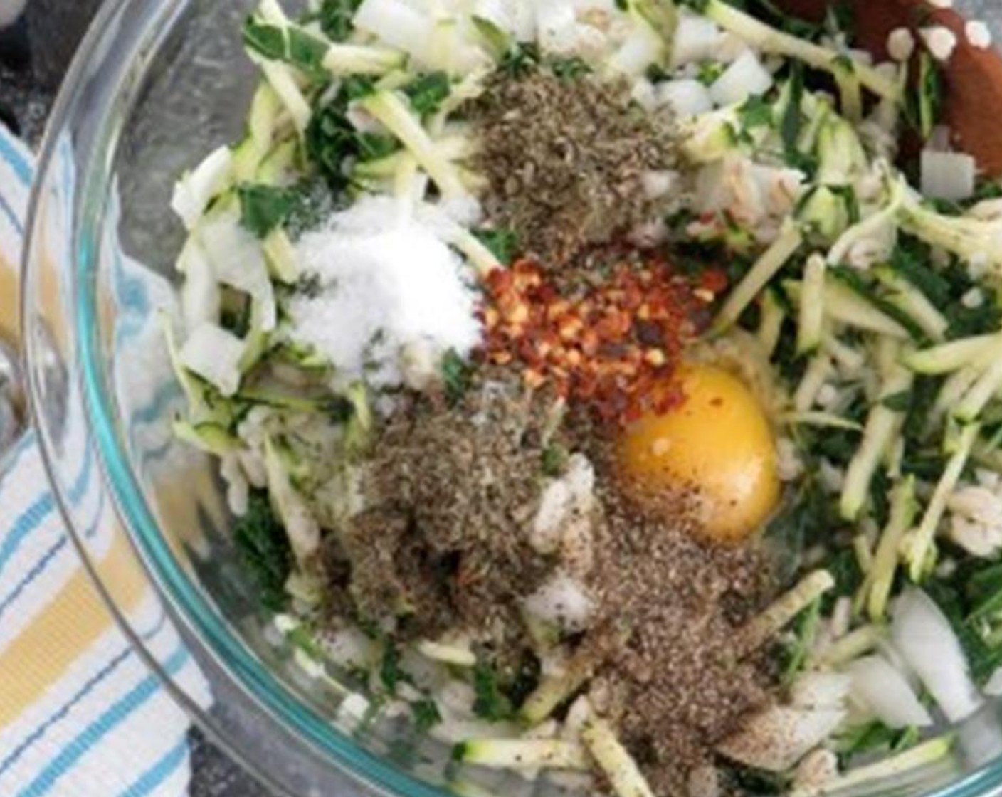 step 4 In a large bowl, combine the Old Fashioned Rolled Oats (1/2 cup), Egg (1), onion mixture, Extra Lean Ground Turkey (1.3 lb). Low-Moisture Part-Skim Mozzarella Cheese (1/2 cup). Mix with your hands. Add the Chicken Broth (1/3 cup) and mix again so that the broth is incorporated.