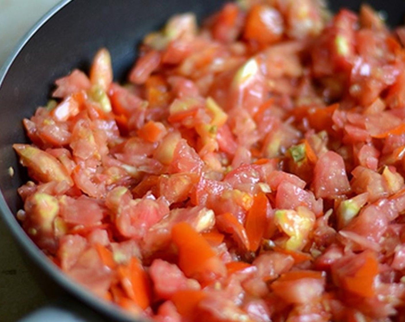 step 4 Add the tomatoes and let it reduce over medium-low heat until all the water has evaporated.