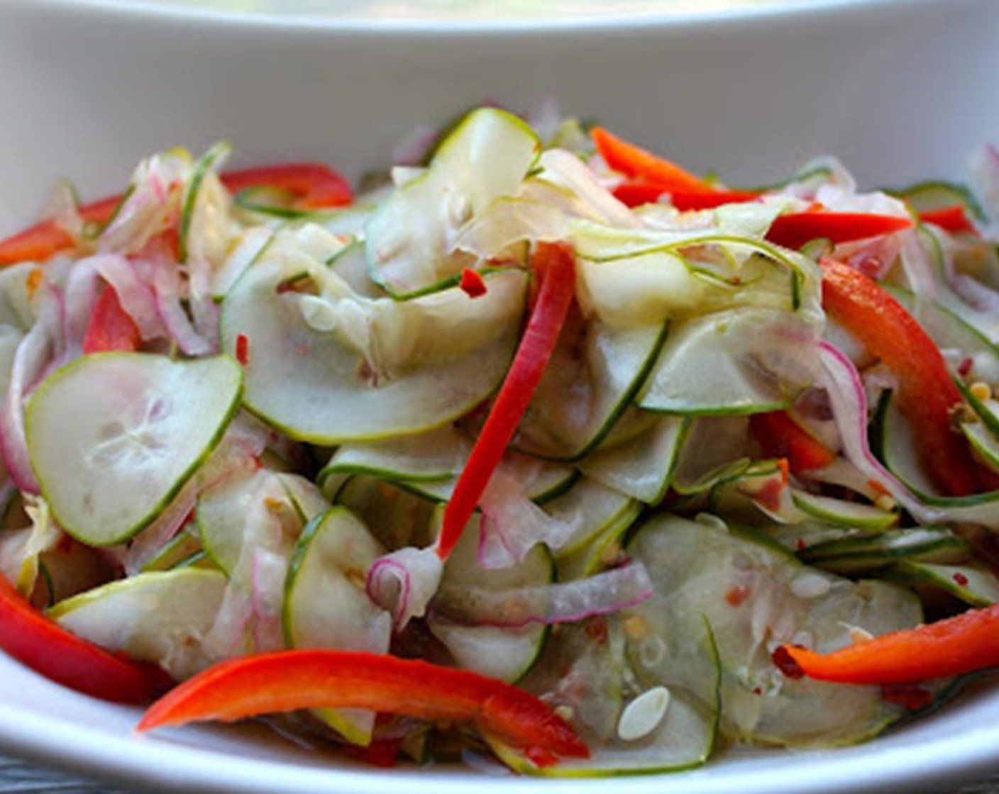 step 2 Bring to a boil. Simmer for 5 minutes and remove from the heat. Place Red Bell Pepper (1/2), Red Onion (1/2), and English Cucumbers (2) in a heat-safe bowl and pour the brine over them.