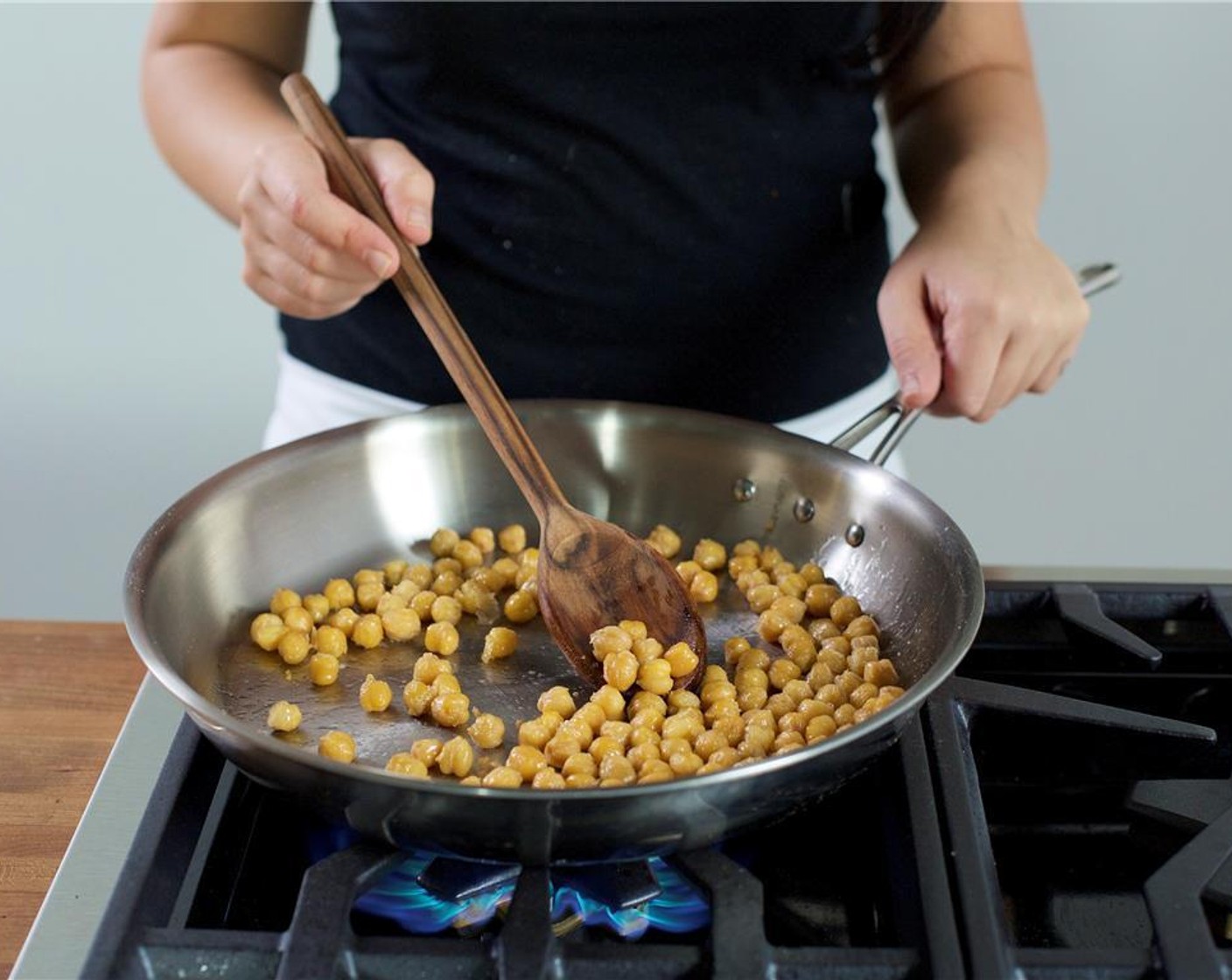 step 10 In a large saute pan over high heat, add one tablespoon of olive oil. Add the Chickpeas (1 can) and saute for 4 minutes until golden brown.