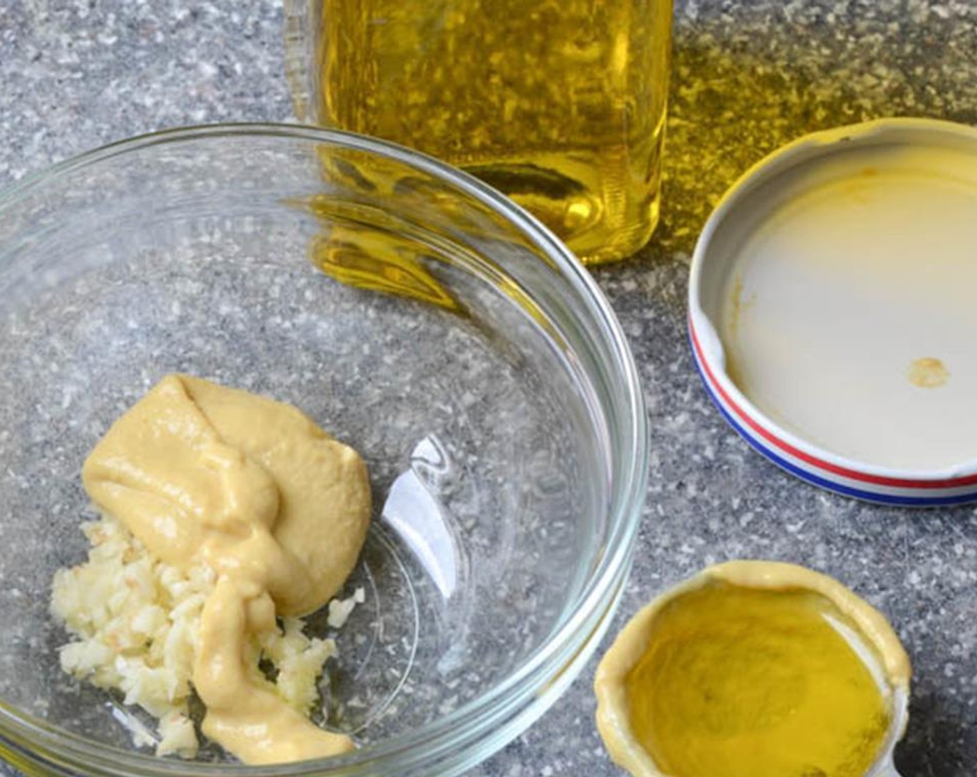 step 3 In a small bowl, add the minced Garlic (1 clove) and Dijon Mustard (1 Tbsp).