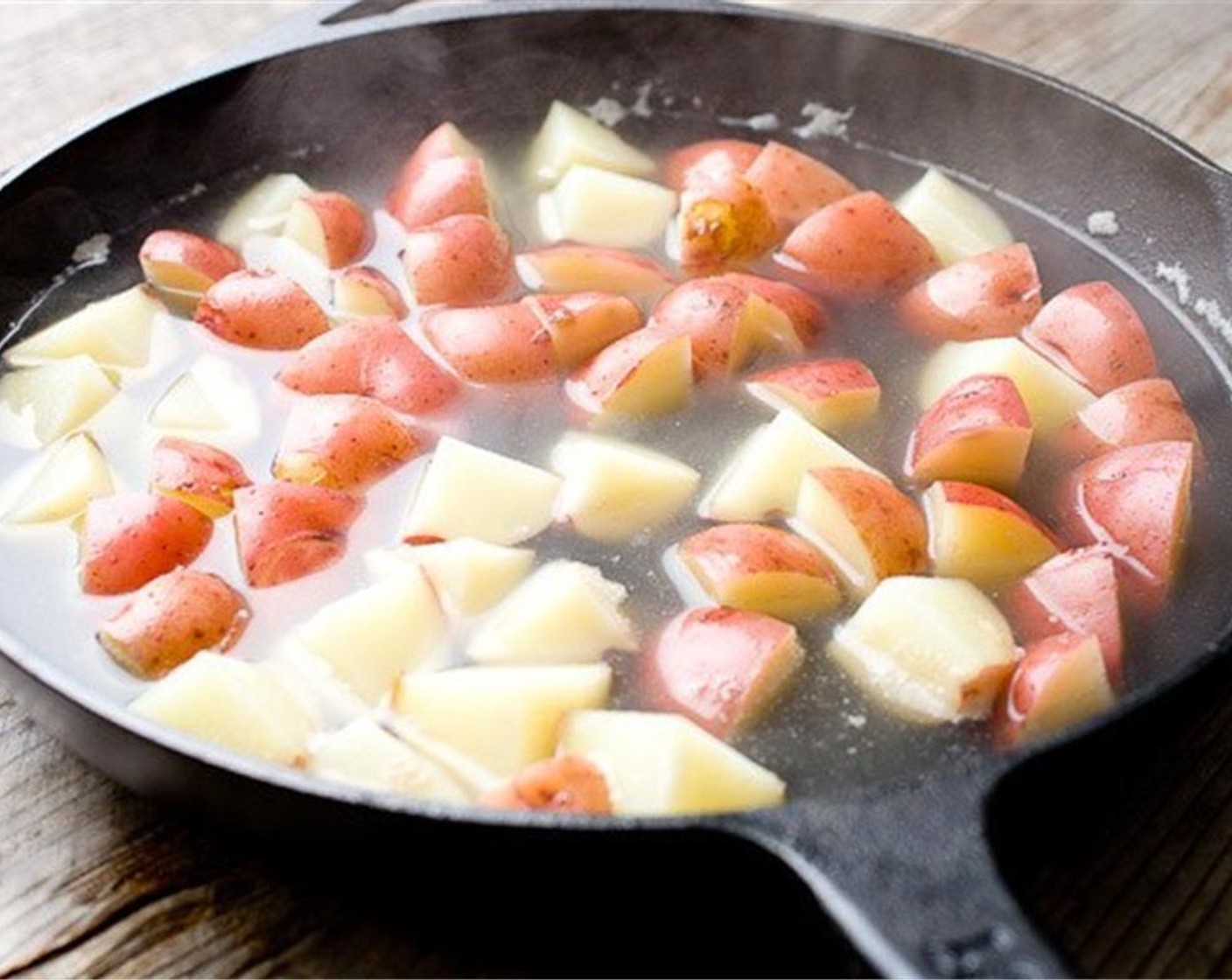 step 2 Blanch New Potatoes (3 cups) in a skillet for a few minutes until they are tender, but not falling apart. When the potatoes are done, drain them and wipe out the skillet so it is dry.