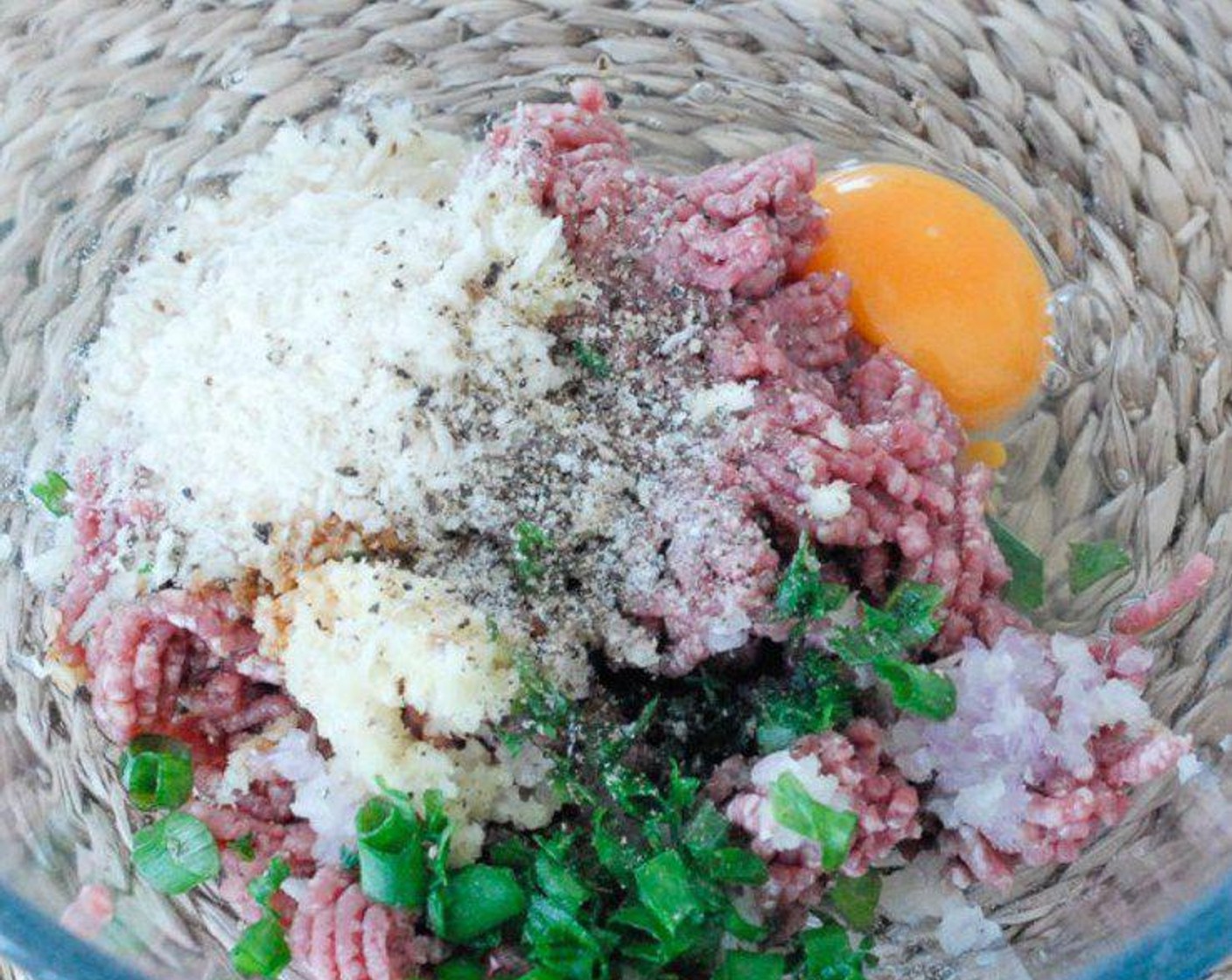 step 2 Mix Ground Beef (10.5 oz), Egg (1), Breadcrumbs (2/3 cup), Garlic (1 Tbsp), Fresh Ginger (1 tsp), and Scallions (to taste) in a big bowl, season with Salt (to taste) and Ground Black Pepper (to taste).