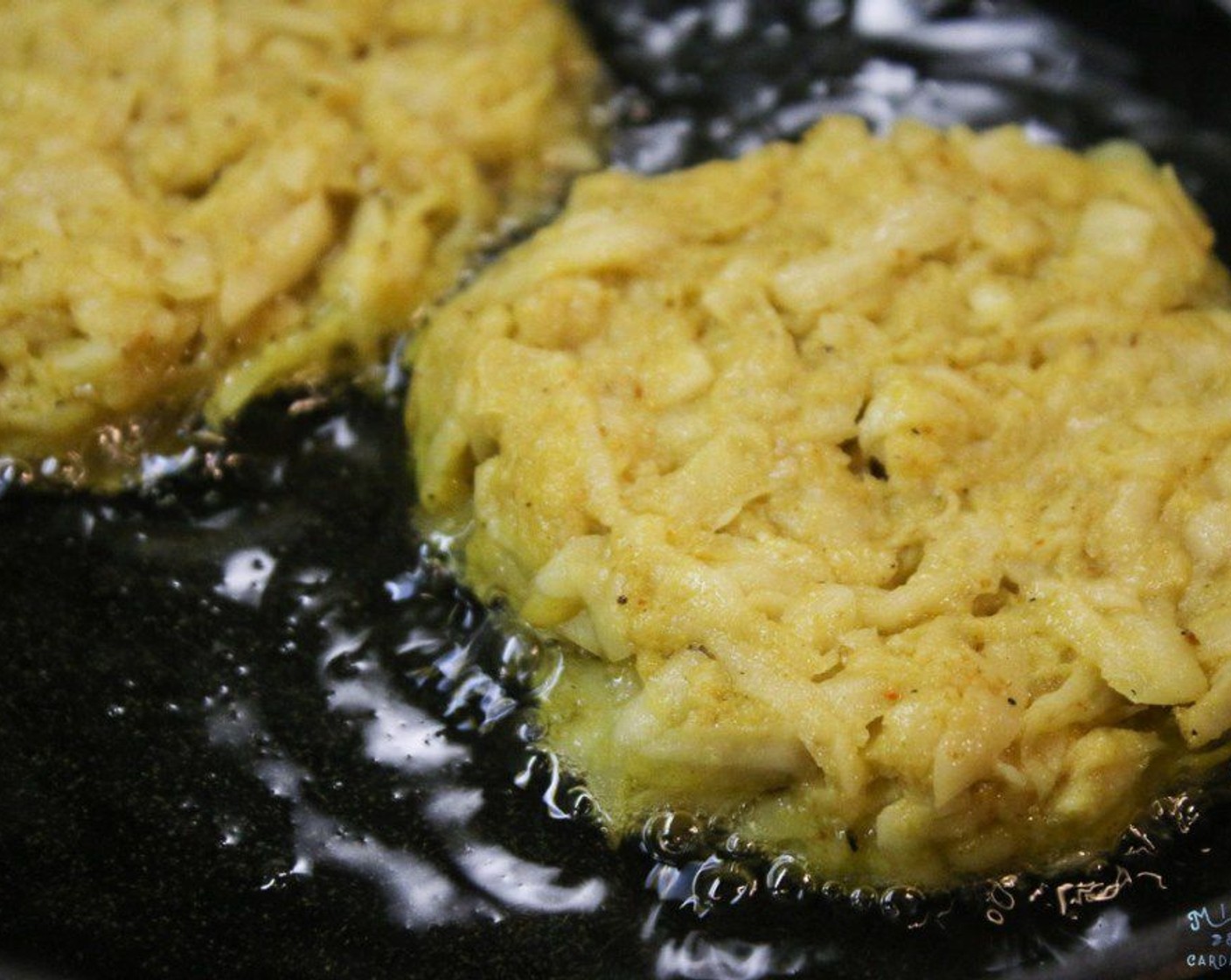 step 8 Place the ball into the hot oil and press down with a spatula until it is 1/2 inch thick. Place more latkes into the pan if you have room in your skillet. Cook for 3 minutes or until golden brown. Carefully flip the latkes and cook for an additional 3 minutes or until golden brown. Place the cooked latke on a paper towel to get rid of excess oil.