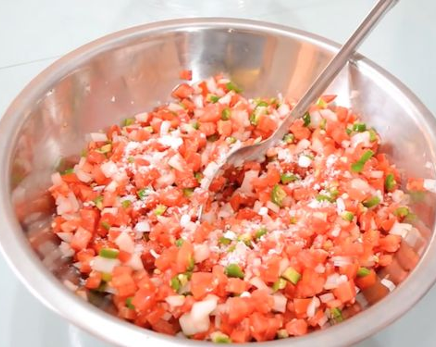 step 2 Mix the chopped tomato, serrano peppers, onion, and garlic well in a bowl and season with Coarse Salt (1 Tbsp) and Freshly Ground Black Pepper (1 Tbsp). Cover and place in the fridge for 24 hours to marinate.