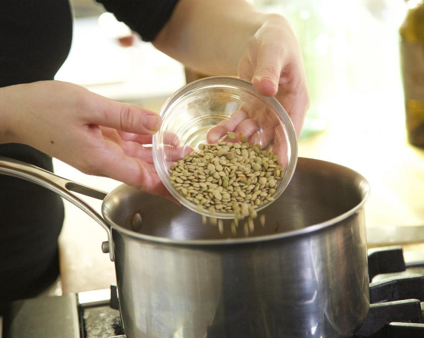 step 9 Cook until translucent, about 10 minutes. Add the Green Lentils (1 cup), Brown Rice (2/3 cup), Water (4 cups), and Salt (1 tsp) and bring to a boil.