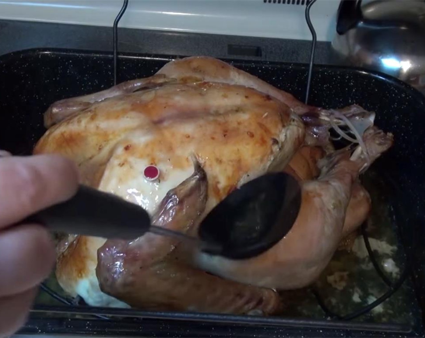 step 14 Remove pan from oven, and baste turkey with the pan juices one more time. Loosley cover the pan with aluminum foil, and return the turkey to the oven for an extra 30 minutes.