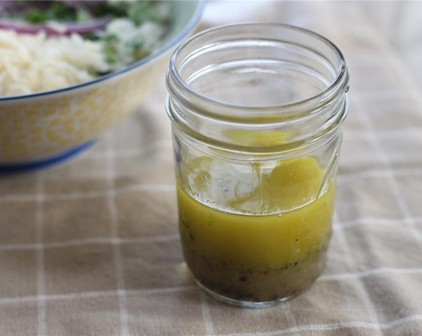 step 7 In a mixing bowl, whisk the Extra-Virgin Olive Oil (4 Tbsp), zest, and juice from the key limes, Salt (to taste), and Ground Black Pepper (to taste) to make the dressing for the slaw.