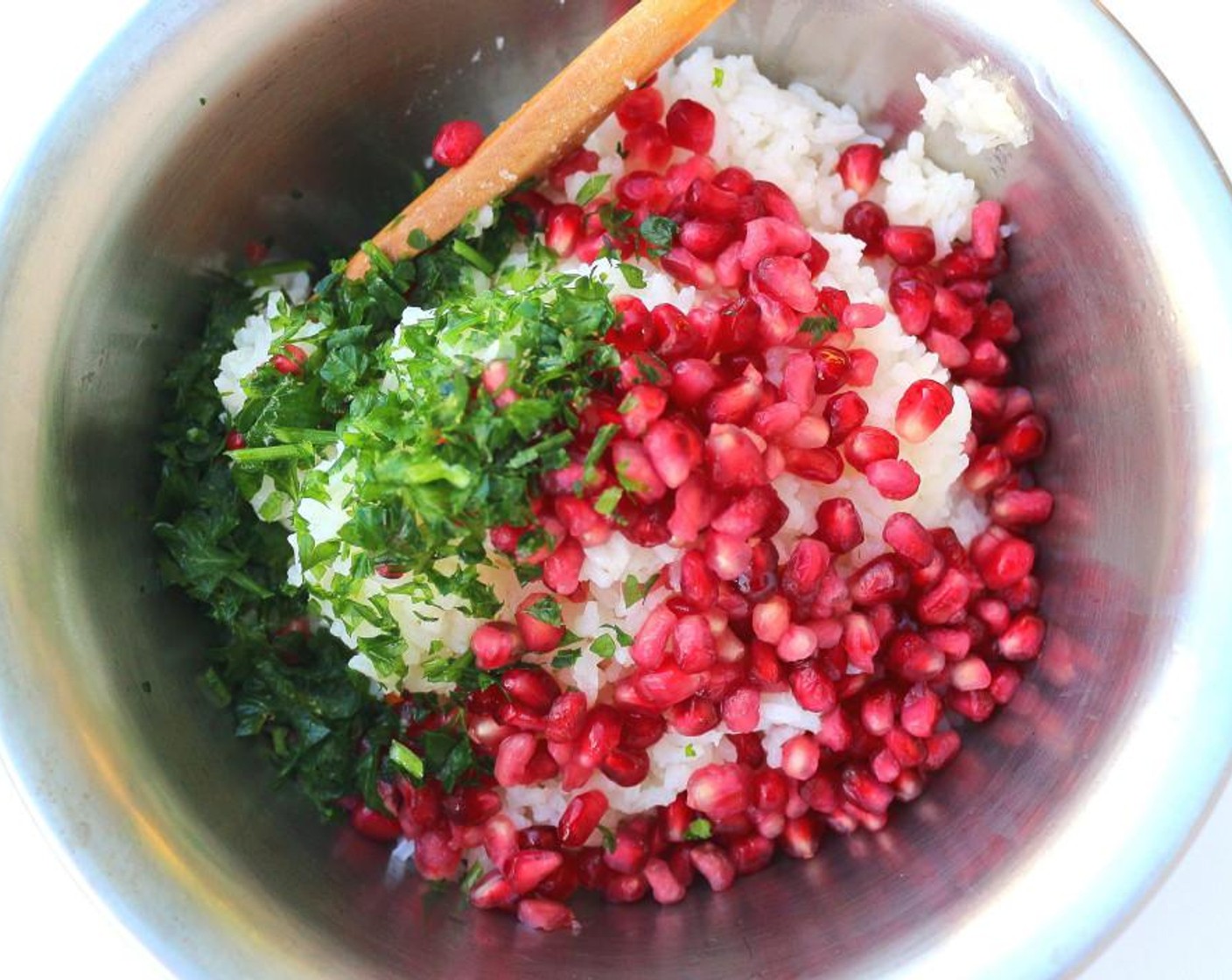 step 6 While the tonkatsu are cooking, mix White Rice (4 cups) with Butter (1/2 cup), Fresh Cilantro (1/4 cup) and Pomegranate Seeds (2 2/3 cups). Mix carefully as not to mash-up the rice or the seeds.
