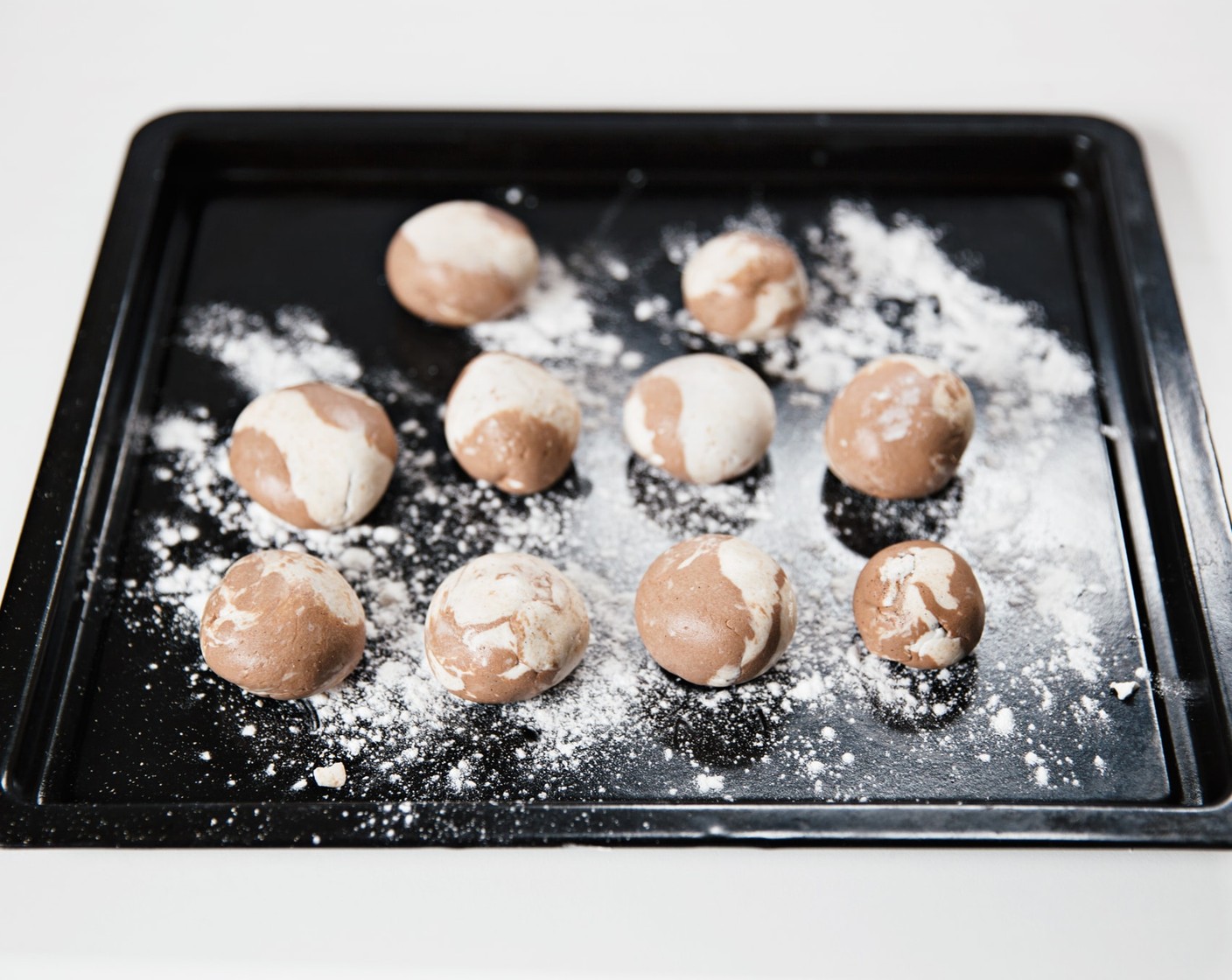 step 12 Wrap each sesame seed ball with two-tone "wrapper" and set aside.