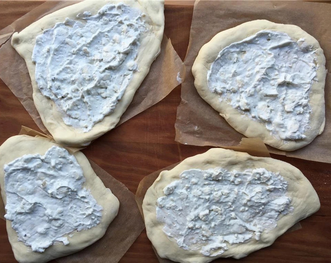 step 10 Apply a nice thin layer of the blue cheese crema, about a tablespoon or so. Don't put too much because it'll make the crust soggy.