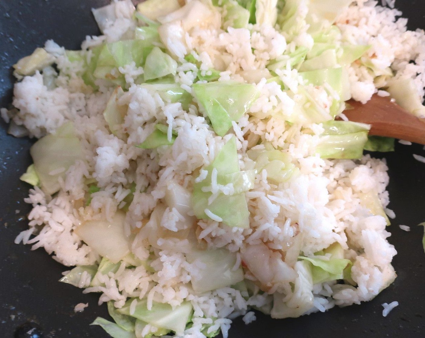 step 8 Add the White Rice (4 cups), stir fry until the rice starts to “pop”.