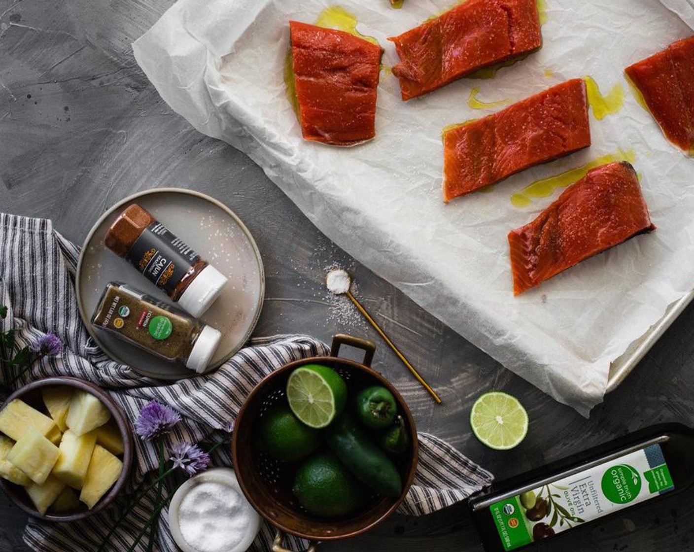 step 2 Place Copper River Sockeye Salmon (1) fillets on parchment paper or an aluminum foil-lined baking sheet. Drizzle filets with Extra-Virgin Olive Oil (1/4 cup), half a Lime (1), and Honey (1 Tbsp) and rub into the salmon fillets.