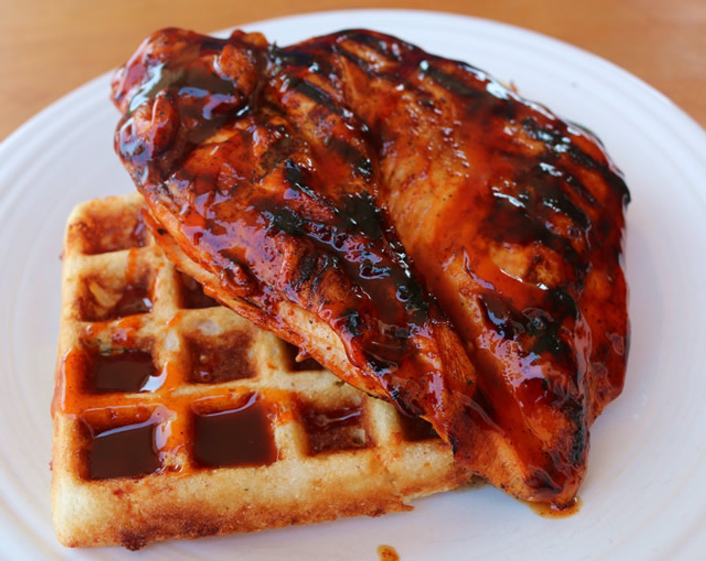 step 9 Serve BBQ Chicken over Cornbread Waffles and drizzle with additional BBQ Glaze.
