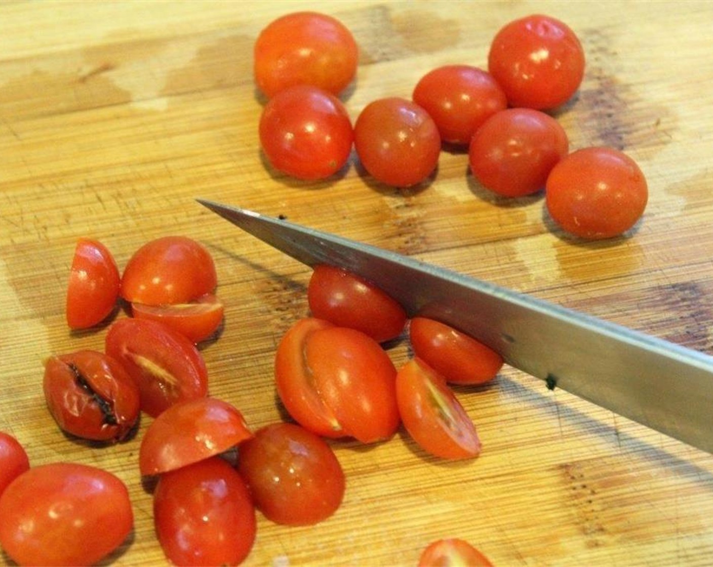 step 4 Cut the Cherry Tomato (1 cup) in half.