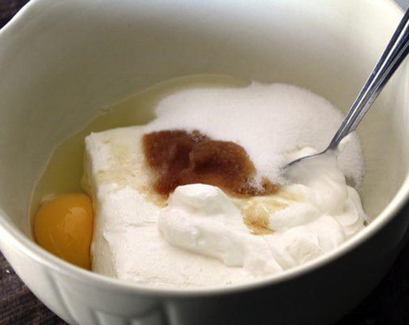 step 3 While the butter is cooling, using a hand held mixer, combine the Cream Cheese (1 cup), Sour Cream (1/2 cup), Eggland's Best Classic Egg (1), Granulated Sugar (1/2 cup), and Vanilla Extract (1/2 tsp) until smooth and creamy. Set aside.
